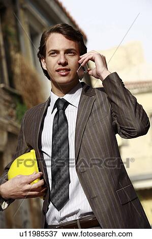 Man in suit with hard hat View Large Photo Image Stock Photo - Man in suit with hard hat. Fotosearch