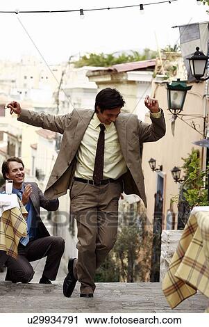 Two businessmen Greek dancing View Large Photo Image Stock Image - Two businessmen Greek dancing. Fotosearch