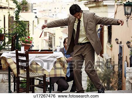 Two businessmen Greek dancing View Large Photo Image Stock Photograph - Two businessmen Greek dancing. Fotosearch