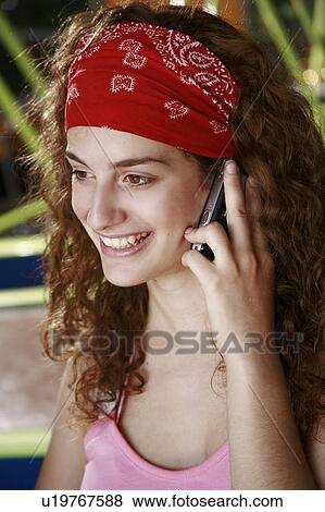 Female teenager on cell phone View Large Photo Image Stock Photo - Female teenager on cell phone. Fotosearch