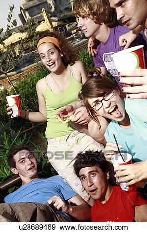 Teenagers hanging out, eating View Large Photo Image Stock Photo - Teenagers hanging out, eating. Fotosearch