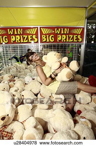 Female teenager among teddy bears in arcade View Large Photo Image Stock Photo - Female teenager among teddy bears in arcade. Fotosearch