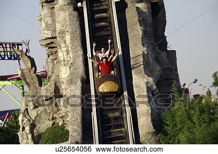Teenagers on amusement park ride View Large Photo Image Stock Photograph - Teenagers on amusement park ride. Fotosearch