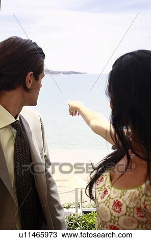 Business man and woman pointing View Large Photo Image Stock Image - Business man and woman pointing. Fotosearch
