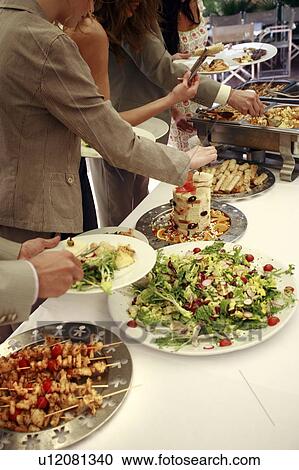 Business people at lunch buffet View Large Photo Image Stock Image - Business people at lunch buffet. Fotosearch