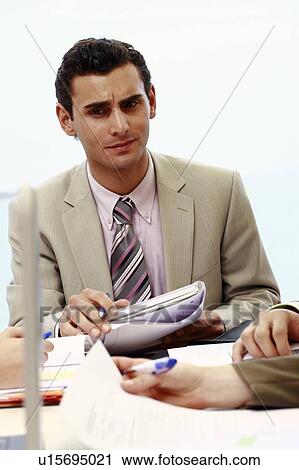 Closeup of businessman at meeting View Large Photo Image Stock Image - Closeup of businessman at meeting. Fotosearch