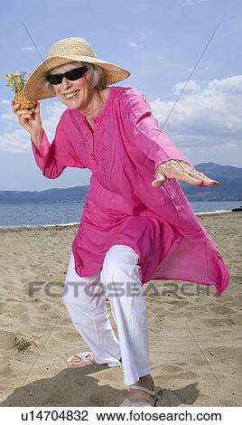 Female senior on the beach View Large Photo Image Stock Image - Female senior on the beach. Fotosearch