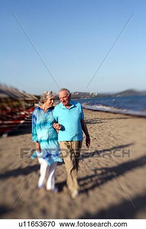 Senior couple on beach View Large Photo Image Stock Image - Senior couple on beach. Fotosearch