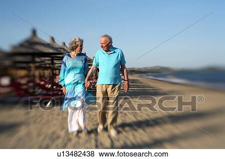 Senior couple on beach View Large Photo Image Stock Photo - Senior couple on beach. Fotosearch