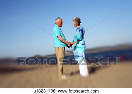 Senior couple on beach View Large Photo Image Stock Photograph - Senior couple on beach. Fotosearch