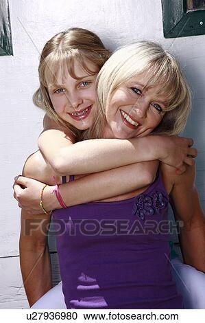 Stock Image - Mother and daughter posing. Fotosearch