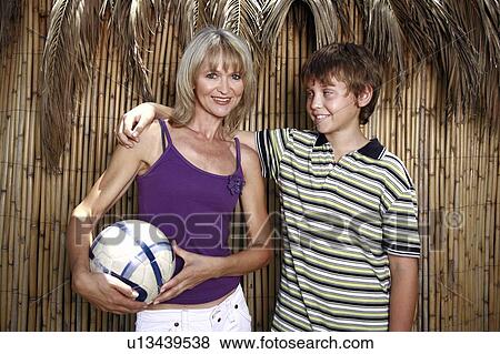 Stock Photo - Mother with son and ball. Fotosearch