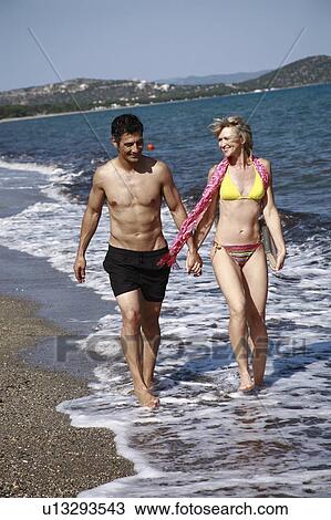 Mature adult couple on beach View Large Photo Image Stock Image - Mature adult couple on beach. Fotosearch