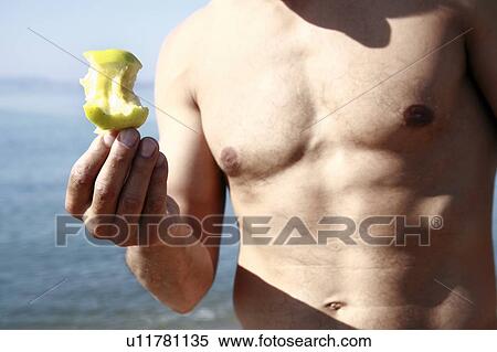 Male mature adult with apple on beach View Large Photo Image Stock Photography - Male mature adult with apple on beach. Fotosearch