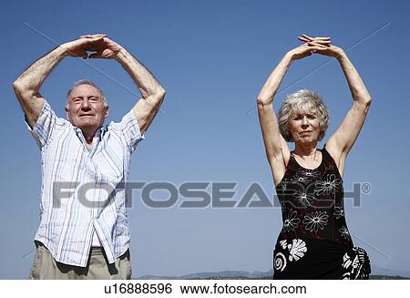 Senior couple exercising View Large Photo Image Stock Photograph - Senior couple exercising. Fotosearch