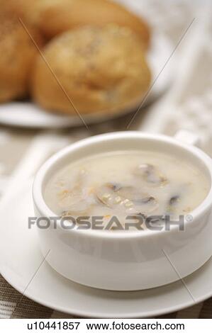 Stock Photo - Bowl of soup on plate. Fotosearch