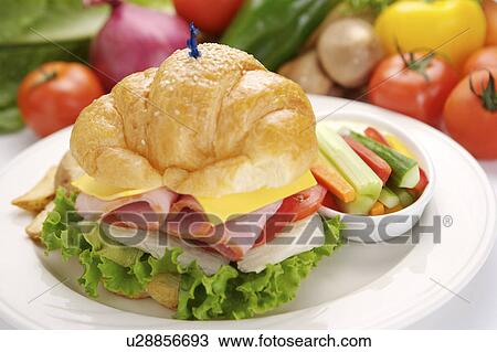 Croissant with salad on plate View Large Photo Image Stock Image - Croissant with salad on plate. Fotosearch