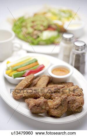 Fried chicken on plate with sauce View Large Photo Image Stock Image - Fried chicken on plate with sauce. Fotosearch