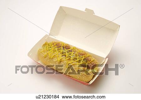 Hotdog with mustard and ketchup on take-out box View Large Photo Image Picture - Hotdog with mustard and ketchup on take-out box. Fotosearch