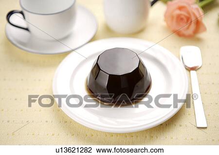 Jelly on plate with a cup aside View Large Photo Image Stock Image - Jelly on plate with a cup aside. Fotosearch