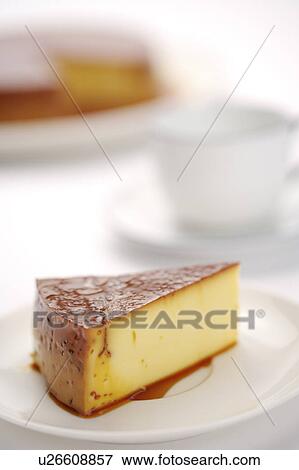Stock Photo - Piece of flan with caramel glaze on plate. Fotosearch