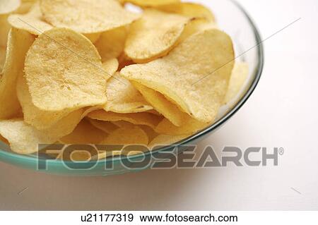Stock Photo - Potato chips in glass bowl. Fotosearch