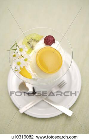 Stock Image - Pudding in glass, elevated view. Fotosearch