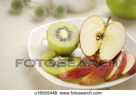 Sliced fruits on plate View Large Photo Image Stock Photo - Sliced fruits on plate. Fotosearch