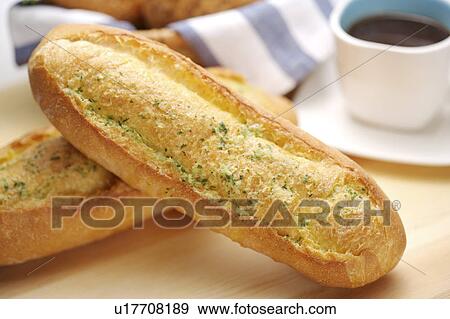 Stock Photo - Two loaves of French bread, close-up. Fotosearch