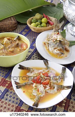 Stock Photograph - Spicy & Sour Raw Shrimp and Steamed Fish With Lemon Sauce. Fotosearch