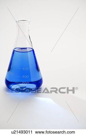 Flask with blue liquid, close up View Large Photo Image Stock Image - Flask with blue liquid, close up. Fotosearch