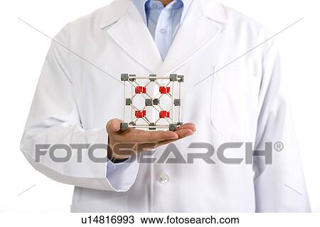 One man in lab coat holding molecular structure, mid section View Large Photo Image Stock Image - One man in lab coat holding molecular structure, mid section. Fotosearch
