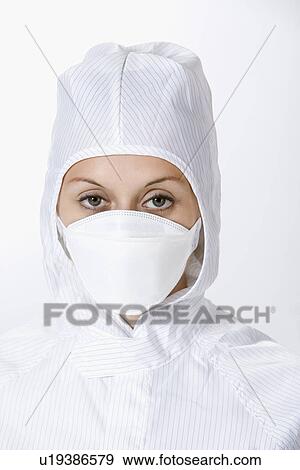 One woman wearing protective suit and surgical mask, close up View Large Photo Image Stock Photo - One woman wearing protective suit and surgical mask, close up. Fotosearch