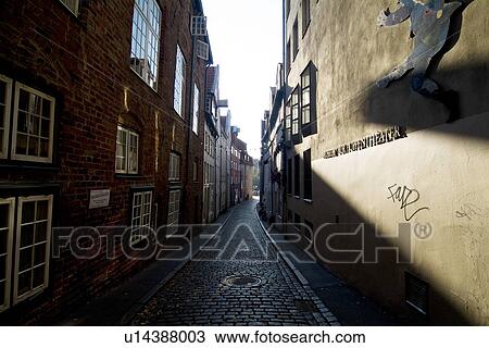 Alley between buildings View Large Photo Image Stock Image - Alley between buildings. Fotosearch
