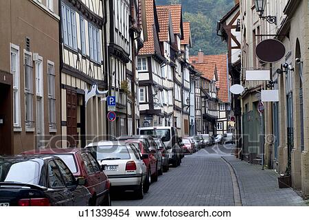 Picture - Cars parking by houses in street. Fotosearch