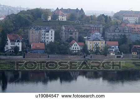 Houses and trees by river View Large Photo Image Stock Photo - Houses and trees by river. Fotosearch