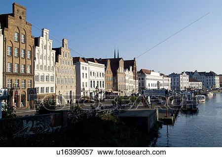 Stock Photo - Houses by river with boats. Fotosearch