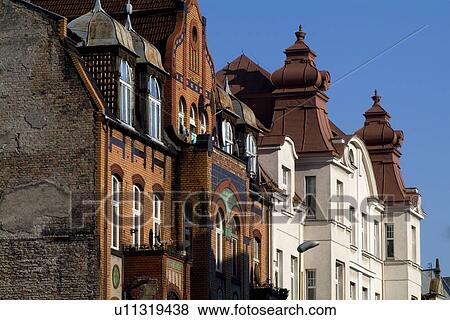 Stock Photo - Houses in a row against sky. Fotosearch