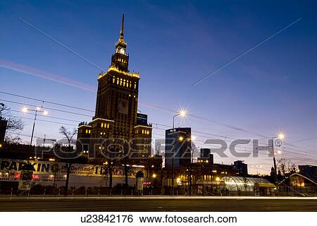 Stock Photograph - Illuminated street scene under clear sky. Fotosearch