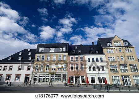 Low angle view of houses on street View Large Photo Image Stock Photo - Low angle view of houses on street. Fotosearch