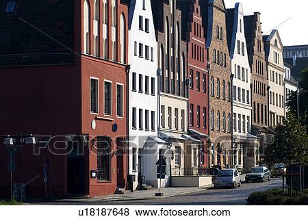 Stock Photo - Row of houses and cars paling aside. Fotosearch