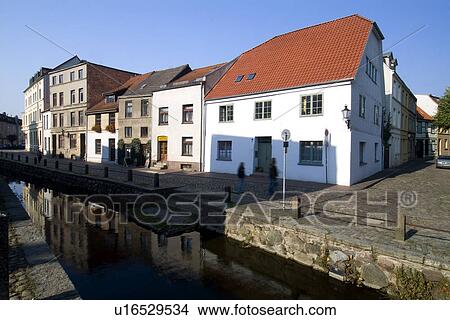 Row of houses by river View Large Photo Image Picture - Row of houses by river. Fotosearch