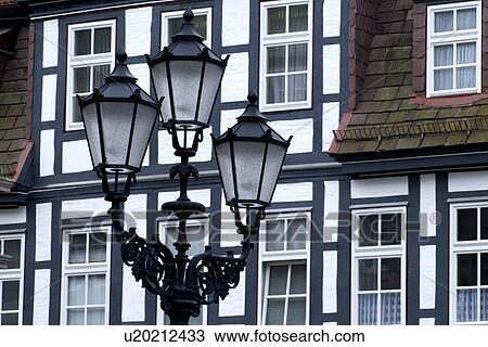 Street light with houses in the background View Large Photo Image Stock Image - Street light with houses in the background. Fotosearch
