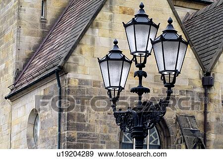 Stock Photo - Street light with houses in the background. Fotosearch