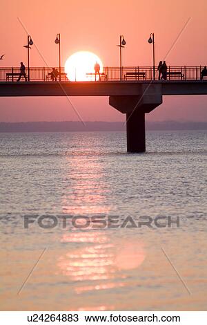 Stock Image - Sunset by bridge. Fotosearch