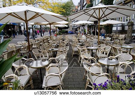 Tables With Umbrellas And Chairs In An Outdoor Restaurant Stock Stock Photograph Tables With Umbrellas And Chairs In An Outdoor Restaurant Fotosearch