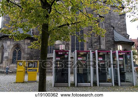 Telephone booth at corner of street with tree View Large Photo Image Stock Image - Telephone booth at corner of street with tree. Fotosearch