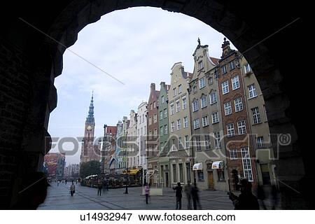 View under an arch with buildings on street View Large Photo Image Stock Photo - View under an arch with buildings on street. Fotosearch