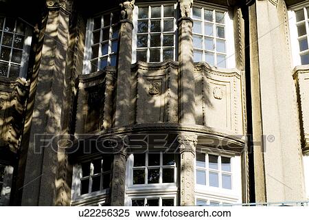 Stock Photography - Windows of a building with tree shadow. Fotosearch
