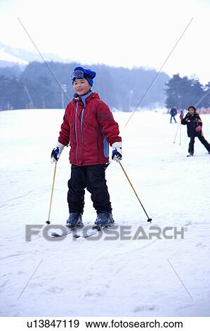 One young boy in ski resort View Large Photo Image Stock Photo - One young boy in ski resort. Fotosearch